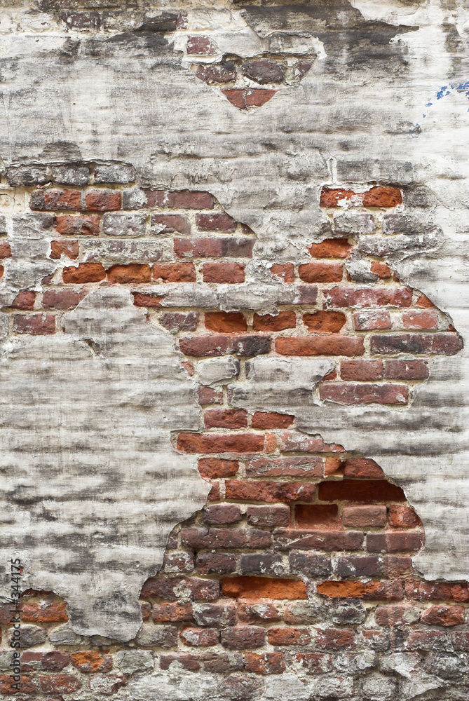 Fotografija aged red brick wall with remaining plaster spots