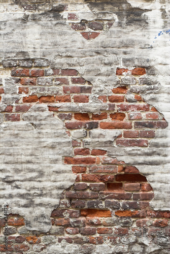Obraz na plátně aged red brick wall with remaining plaster spots