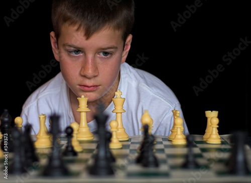 boy playing chess photo