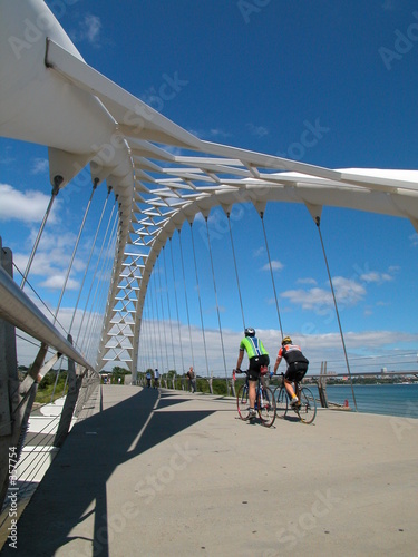Photography cyclists on bridge