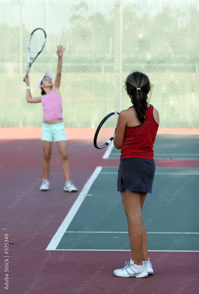 two girls at tennis practice