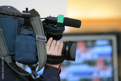 cameraman and newscast photo