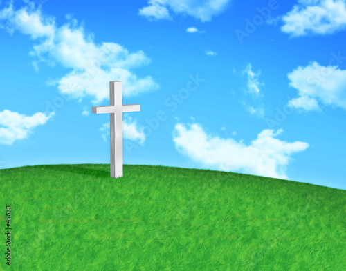 white cross on hilltop