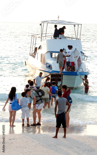 holiday makers boarding ship photo