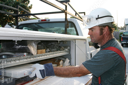 electrician with service truck