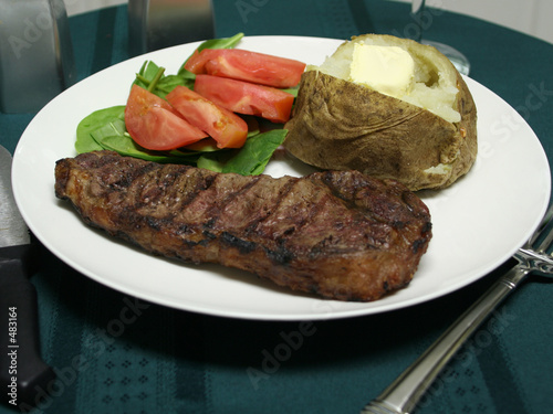 grilled steak dinner with utensils