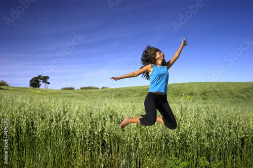 jumping on a green field