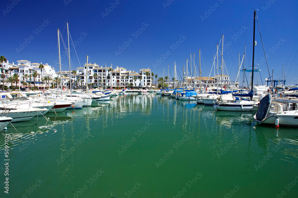 boats and yachts moored in duquesa port in spain on the costa de