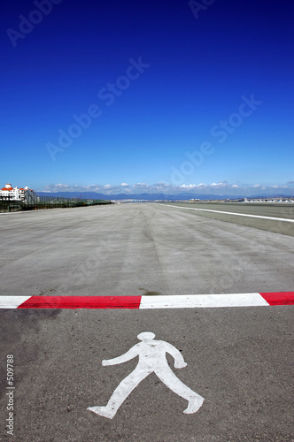 symbol of walking man on runway at gibraltar airport