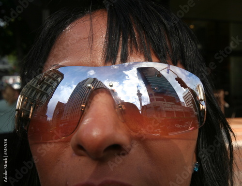 sky tower reflection in sunglases photo