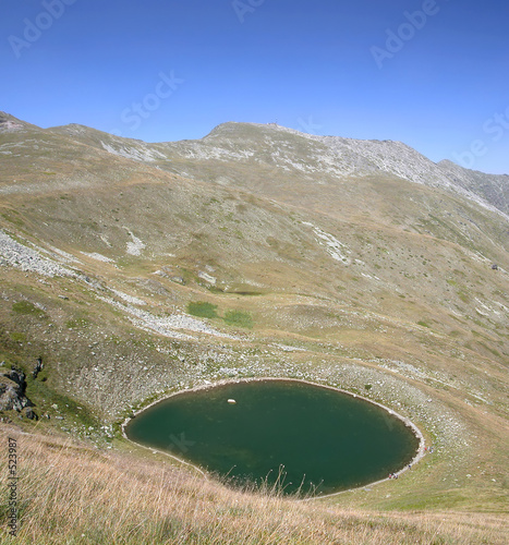 a view of a glacial lake and summit in maceonia photo