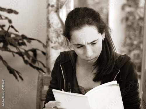 serious girl reading a book