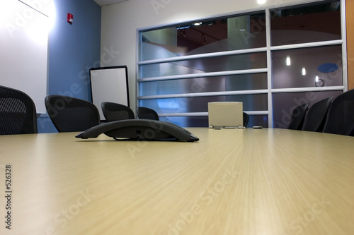 conference room with a laptop and a pda on the table