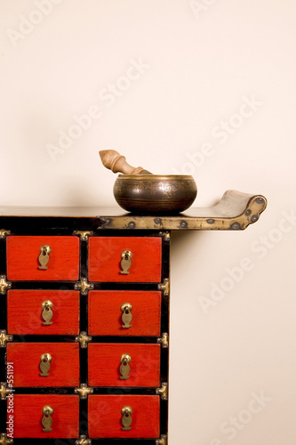 a prayer bowl and a medicine cabinet