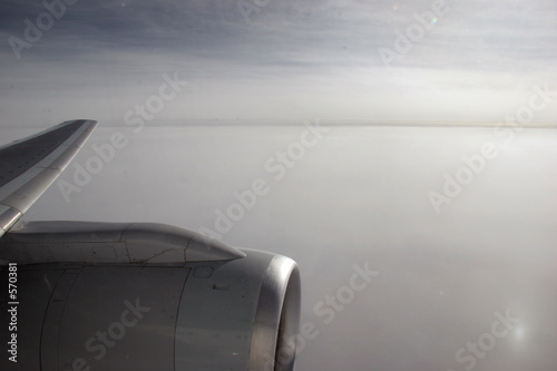 airplane wing and engine in flight