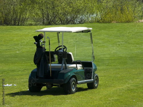 golf cart sitting on greens