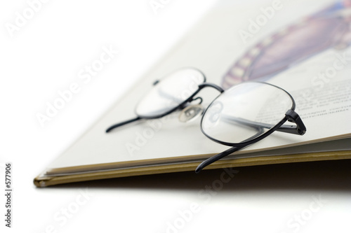 book and a pair of glasses