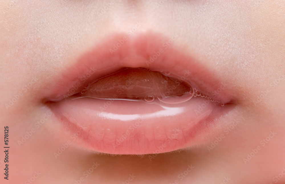Fototapeta premium close up of lips of baby girl
