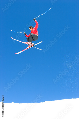 man skiing on slopes of ski resort in spain