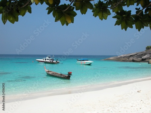 boats moored on similan island beach, thailand
