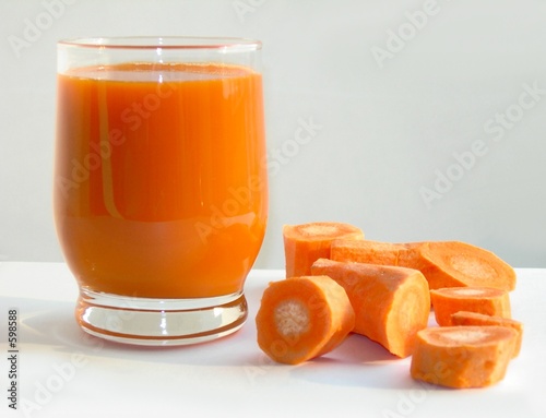 carrot and carrot juice in a glass photo