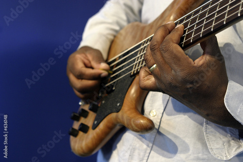 man playing guitar fingering photo