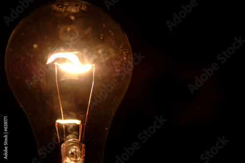 clear light bulb on black photo