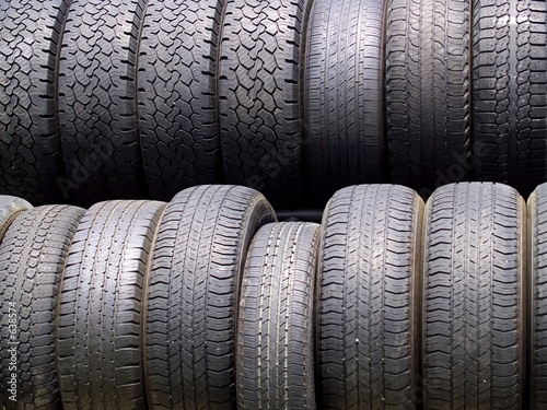 two rows of used tires in diffused light
