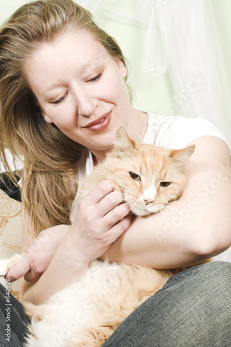 girl petting cat