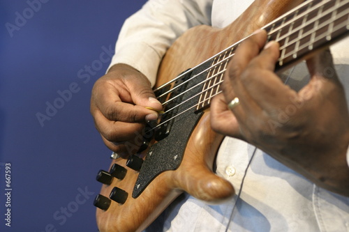 man playing guitar fingering
