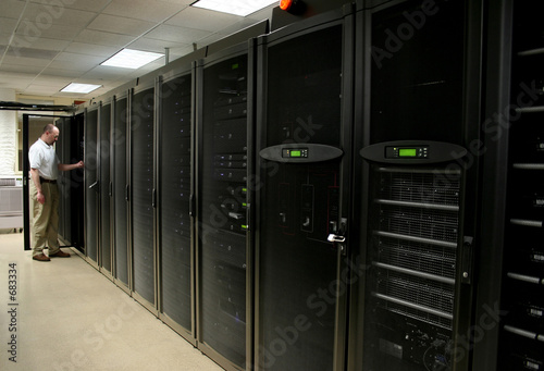 technician working on racks of 1u and 2u servers