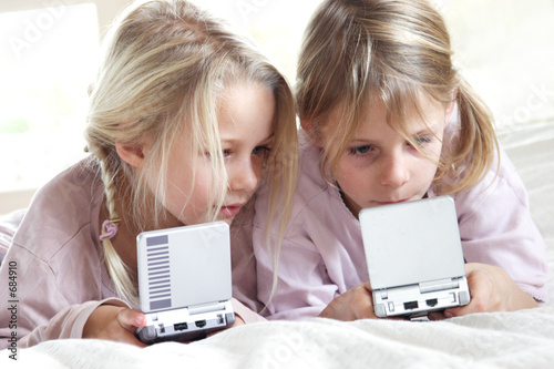 girls playing video games photo