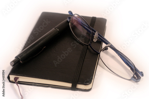 pen, diary and glasses