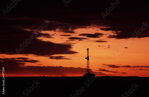 oil rig at sunset © Jim