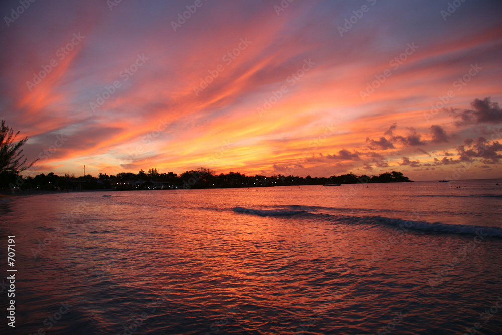 fiery sunset over the water in jamaica