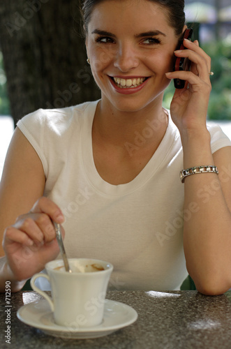 happy young woman with cell phone photo