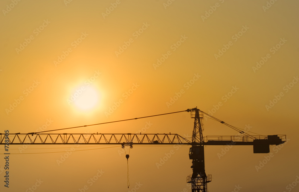 construction crane at sunset