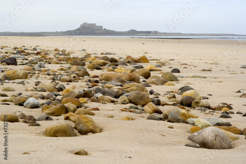 sand, pebbles and holy island