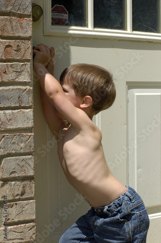 boy opening a door photo