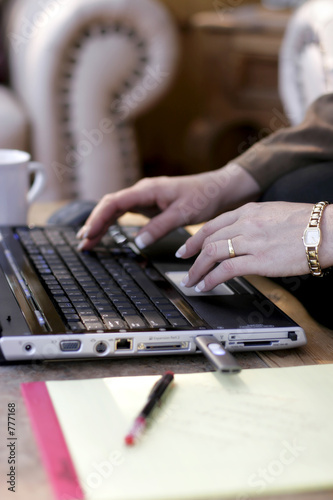 businesswoman typing laptop close-up