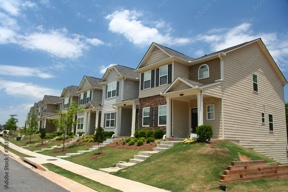a row of new townhomes or condominiums