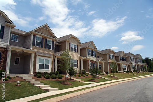 a row of new townhouses or condominiums photo