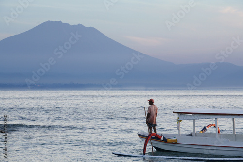 fisherman and beautiful mountain