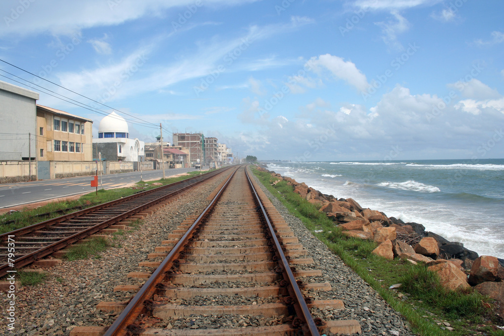 railway track, the blue sky and the blue sea