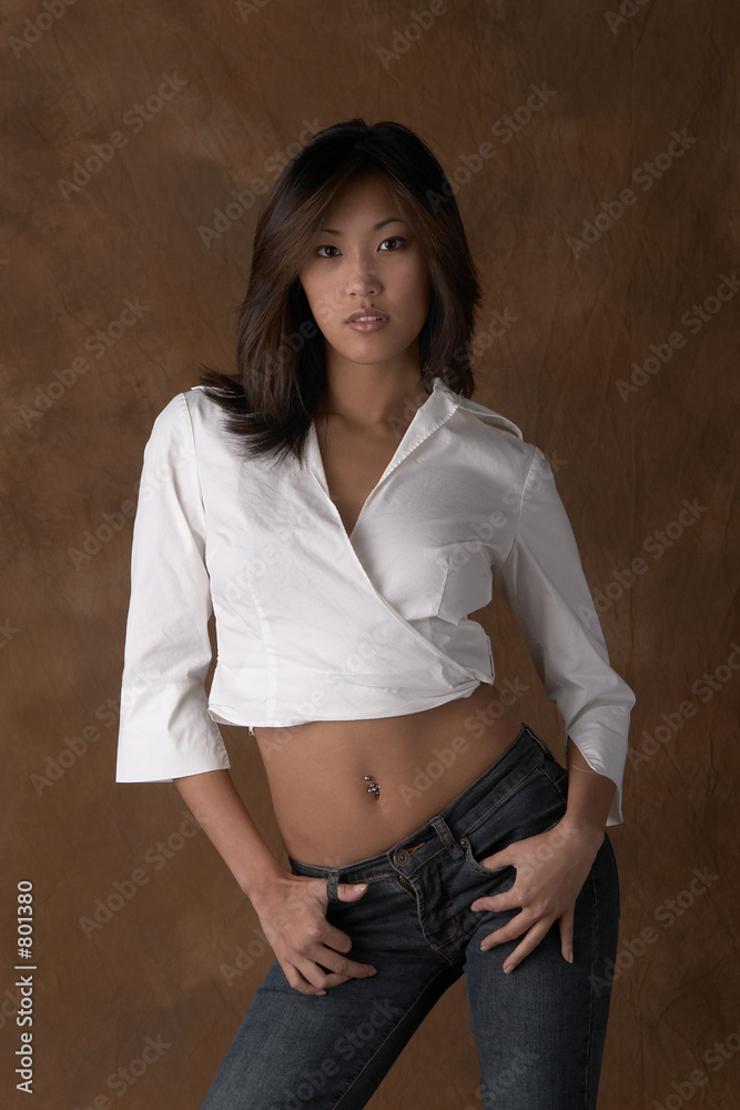 sexy asian woman in jeans and white top Stock Photo | Adobe Stock