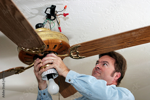 electrician removes ceiling fan