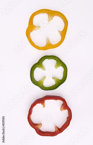 threee slices of red green and yellow pepper - in photo