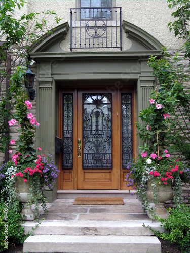 beautiful front door with flowers