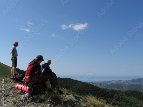 three people in mountains