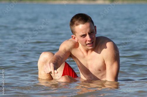teenage boy in lake